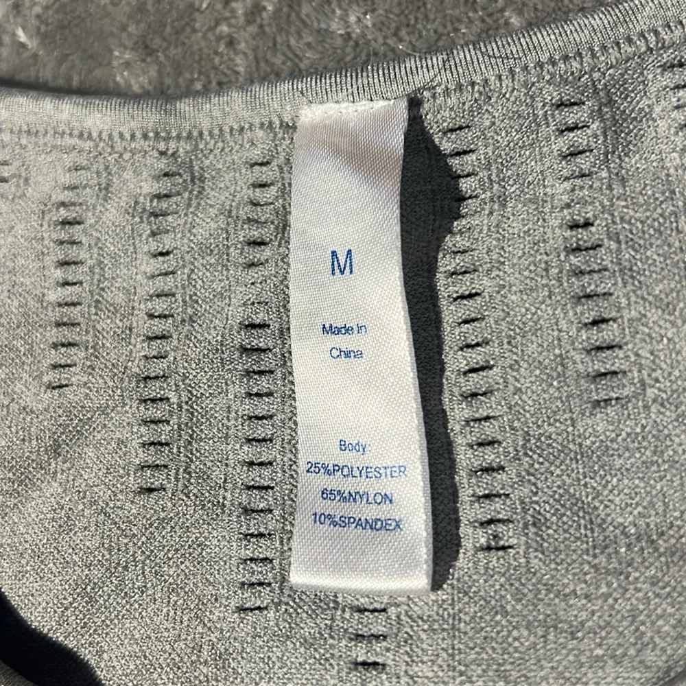 This is a workout shirt, size medium color is grey and black. - Picture 3 of 4